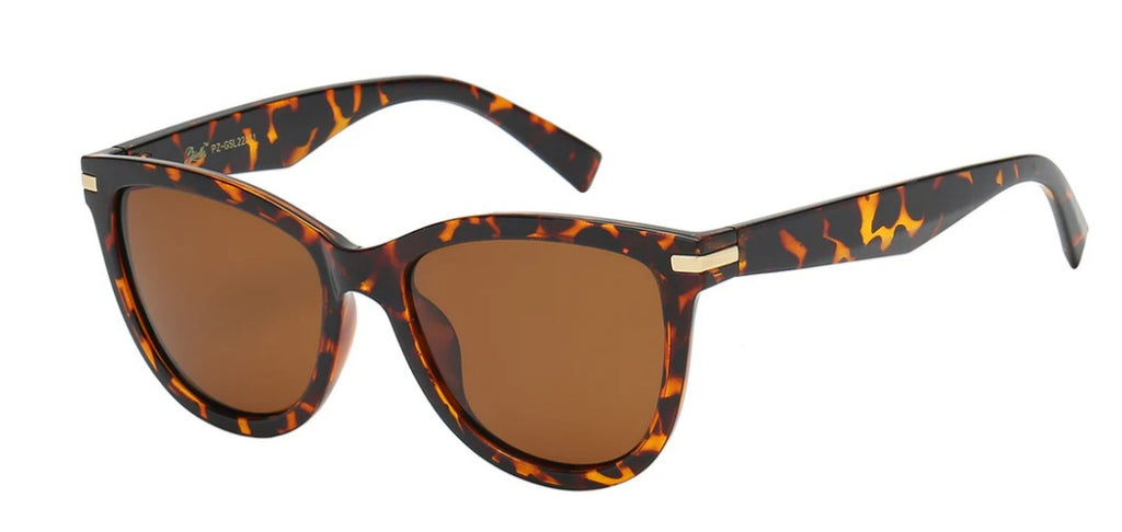 Sunglasses with tortoiseshell frame and brown lenses on a white background